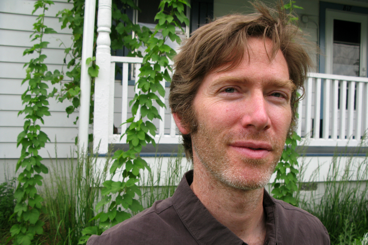 Ian Glomski outside his home in Charlottesville, Va. He quit an academic career in microbiology to start a liquor distillery.